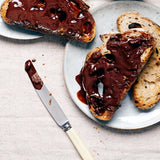 Luxurious Belgian chocolate spread on toast melting 